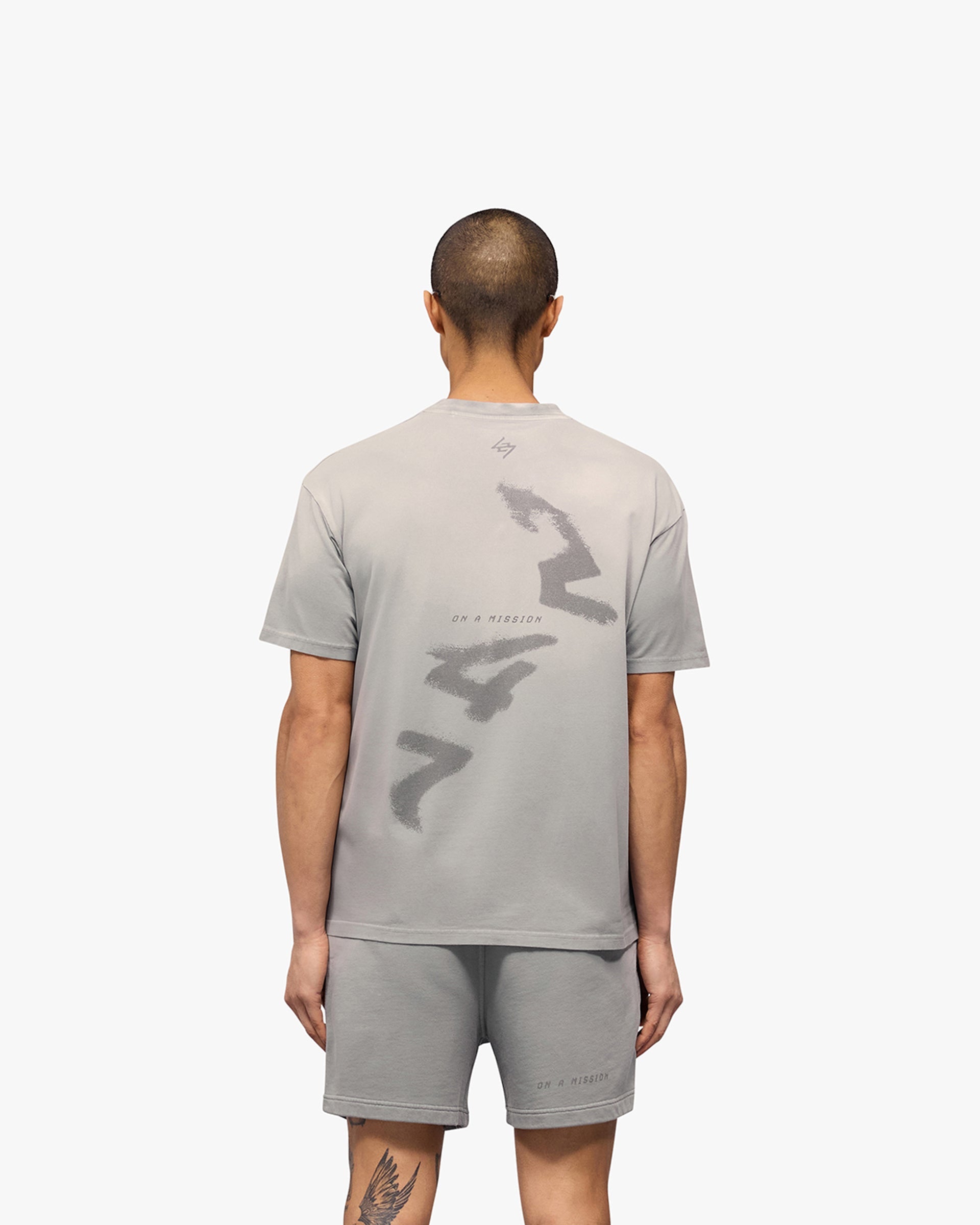 Man wearing a titanium oversized t-shirt on a plain white background | 247 Motion Oversized T-Shirt in Titanium | Relaxed fit t-shirt | 247 T-Shirts | Represent Clo